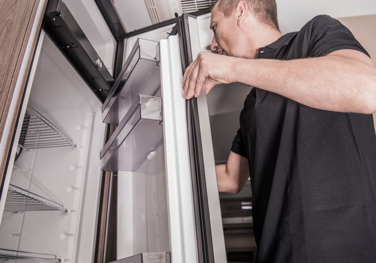 RV owner dealing with fridge and stove problems on the road