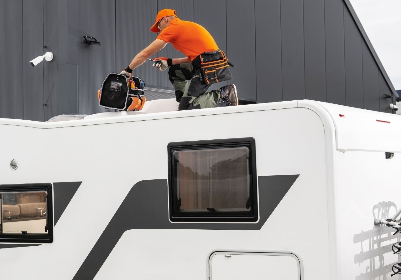 Water-stained RV ceiling and frustrated owner dealing with roof leak