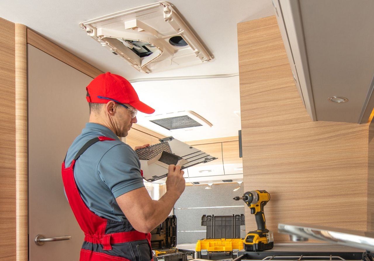 Rooftop RV air conditioning system being diagnosed for cooling issues
